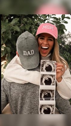 a woman is holding up a box with photos on it and the caption reads, dad