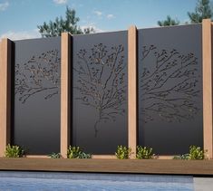 a metal fence with trees on it next to a swimming pool