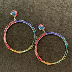 These Are Pretty Large Hoop Earrings With Beautiful Sparkly Austrian Crystals. The Colors Really Pop Because The Metal Is A Dark Gunmetal! Surgical Steel Posts 3.3” X 2.5” W Nickel Free Multicolor Metal Hoop Earrings, Nickel-free Multicolor Metal Hoop Earrings, Multicolor Small Hoop Metal Earrings, Multicolor Circle Earrings For Party, Multicolor Metal Hoop Earrings With Ear Wire, Multicolor Metal Hoop Earrings For Party, Multicolor Round Hoop Earrings For Party, Multicolor Hoop Jewelry For Party, Colorful Hoop Earrings For Party