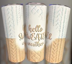 three coffee mugs with the words hello, sunshine and weather printed on them