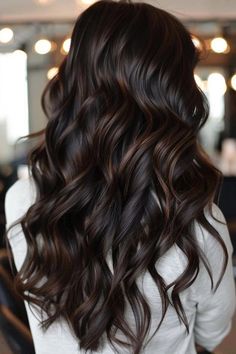 Woman with long, wavy brunette hair with soft highlights. Old Money Dark Brown Hair, Long Layered Brunette Hair, Mocha Highlights On Dark Hair, Long Layered Brunette, Layered Brunette Hair, Ideas For Dark Brown Hair, Mocha Highlights, Dark Hair Hairstyles, Dark Brown Hair Rich