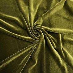 a close up shot of a green velvet fabric