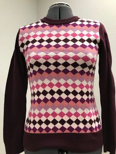 Fun and quirky argyle sweater in great colors of pink and burgundy.  Tag says "maternity," but there is not extra belly room in this delightful sweater.  Wear with jeans, a skirt, layer with pink prints or jackets.  A great statement piece.  Cotton knit and washable.  Slightly faded but otherwise in great condition.