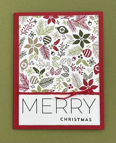 a christmas card with the words merry written in white and red on it, surrounded by holly