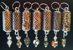 six different types of bead hangings in various styles and colors on a black background