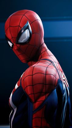 a close up of a spider man wearing a suit