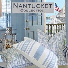 the nantuck collection is on display in front of an american flag and pillows