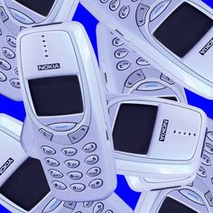 several old cell phones are arranged in a pattern against a blue background with the words nokia on them