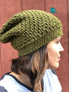 a woman wearing a green knitted hat