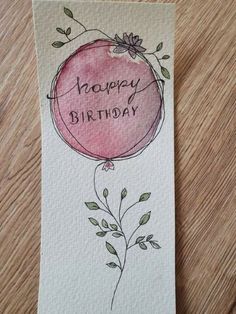 a card with the words happy birthday written on it and a drawing of a balloon