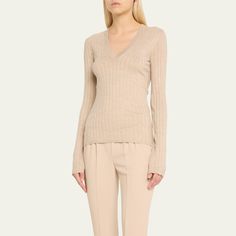 Brunello Cucinelli cashmere and silk lurex ribbed knit top  V-neckline Long sleeves Hip length  Fitted  Pullover style Cashmere/silk/nylon/polyamide Made in Italy Elegant Fine Knit V-neck Sweater For Spring, Fitted Fine Knit V-neck Sweater, Elegant Ribbed Cashmere Tops, Fitted V-neck Cashmere Sweater, Fitted Fine Knit V-neck Sweater For Spring, Elegant Fine Knit Cashmere Top, Elegant Fitted Cashmere V-neck Sweater, Fitted Elegant Cashmere V-neck Sweater, Elegant Textured Knit V-neck Top