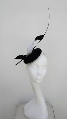 Classic, less is more, dramatic elegance.  This black and white monochrome fascinator is a real statement piece.  Black medium size pillbox base is adorned with a black and white twisted petal, whilst a black quill winds its way through as it shoots for the sky.  Sits on a headband This item has sold, however, similar pieces can be made in a variety of colours.  Please ask for details.  As every piece is handmade, some differences can occur from the photos listed on this site.  Made to order/bes Black And White Fascinator, Hair Styles With Hats, White Fascinator, Abigail Dress, Derby Fascinator, Sinamay Hats, Couture Hats, Hat Fascinator, Bride Hat