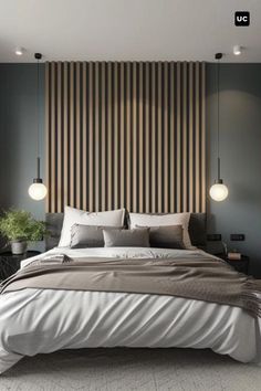 a large bed sitting in the middle of a bedroom next to a wall with vertical stripes on it