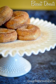 doughnuts sitting on top of a white plate