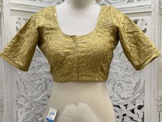 "Gold blouse with gold zari thread work embroidery enhanced with frills and back dori. Material:Dupion Silk Size 38\": The blouse comes with an added allowance and it can be altered to a standard size of 34\"-42\" on request. Size 42\": The blouse comes with an added allowance and it can be altered to a standard size of 34\"-44\" on request. Occasion: Wedding Wear, Traditional Wear, Festive Wear,Designer Blouse,embroidered blouse,Custom Wear Blouse. Note: Colors may slightly vary due to photographic lighting. Please contact us if you have any questions via email,social media,text or whatsapp message on 425-698-9400." Thread Work Embroidery, Gold Blouse, Dupion Silk, Festive Wear, Designer Blouse, Traditional Wear, Thread Work, Embroidered Blouse, Wedding Wear