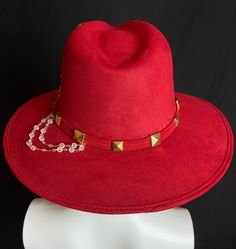 Mexican Handcrafted Red Fedora Hat | El Rosario A complete head-turner & unique Men & Women’s Mexican artisan wool felt hat on this fedora-form in Elegant red color with stud details around hatband, hand embroidered detail around crown & its signature Rosary. A definitive classic from our custom hat collection. SIZE See “Size Chart” below, or CLICK HERE DETAILS Sombrero Box Inner-elastic band (comfortable sizing) Red Fedora Hat, Red Fedora, Felt Fashion, Mexican Fashion, Hat Collection, Elegant Red, Felt Hat, Hat Band, Fedora Hat