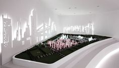 an art installation in the middle of a room with white walls and lights on it