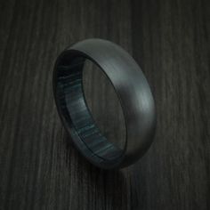 Black Zirconium and Indigo Wood Hard Wood Sleeve Ring Custom Made | Revolution Jewelry Designs Classic Titanium Ring With Polished Finish, Black Promise Ring With Polished Finish, Black Titanium Round Jewelry, Black Titanium Anniversary Rings, Black Polished Round Band Rings, Titanium Rings With Polished Finish, Formal Black Titanium Jewelry, Black Titanium Jewelry With Polished Finish, Modern Black Titanium Jewelry