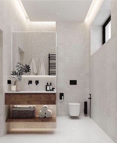 a modern bathroom with white walls and flooring