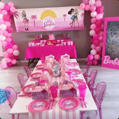 a table set up for a barbie birthday party