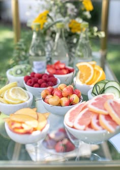 a table topped with lots of different types of fruits and veggies on top of it