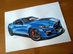 a drawing of a blue sports car on paper