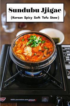 a bowl of soup sitting on top of a stove