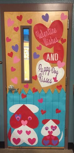 the door to valentine's wishes and puppy dog kisses is decorated with paper hearts