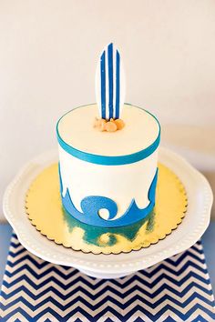 a blue and white cake on a plate