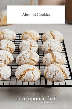 there are many powdered sugar cookies on the cooling rack