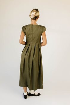 own every fall // winter event with this stunning olive green midi dress. with its sleek square neckline + dainty cap sleeves, it’s a timeless dress you’ll never want to part with, (because why would you?) olive // midi length, square neckline, back zipper closure, cap sleeves, pleat detailing model is 5'8" + wearing a small measurements are approximate + taken while laying flat small : bust 32” length 48” medium : bust 34” length 48” large : bust 36" length 50" more fit + fabric info : cotton / Olive Green Midi Dress, Winter Event, Timeless Dress, Green Midi Dress, Square Necklines, Large Bust, Small Bust, Square Neckline, Midi Length