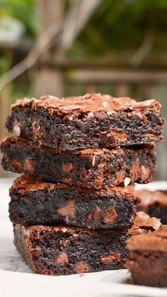 chocolate brownies stacked on top of each other