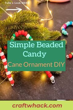 an ornament made out of candy canes on a table with the text simple beaded candy cane ornament diy