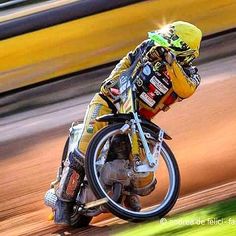 a man riding on the back of a dirt bike