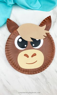 a paper plate with a monkey face on it