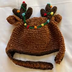 a crocheted hat with moose antlers on it