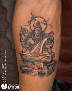 a man's arm with a tattoo on it that has a buddha sitting in the middle