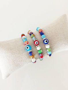 ⭐️The millefiori beads on the stretch bracelets are made of glass. ⭐️These Italian Floral beaded bracelets include multicolored Millefiori beads with glass evil eye. ⭐️This Millefiori Stretch Bracelet with Evil eye charm would be the perfect gift as a protection amulet. For more evil eye bracelets, click the link below; https://www.etsy.com/shop/EyeDesignsbyGG?ref=search_shop_redirect&section_id=30219689 Multicolor Evil Eye Friendship Bracelets With Round Beads, Spiritual Multicolor Beaded Bracelets With Evil Eye, Spiritual Multicolor Stretch Bracelet With Spacer Beads, Multicolor Beaded Bracelets With Evil Eye, Bohemian Multicolor Round Beads Evil Eye Bracelet, Multicolor Evil Eye Bracelet With Colorful Round Beads, Multicolor Evil Eye Friendship Bracelets, Bohemian Style Multicolor Beaded Evil Eye Bracelet, Adjustable Multicolor Evil Eye Bracelet With 8mm Beads