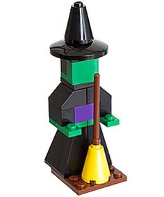 a lego halloween decoration with a witch hat and broom