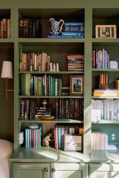 the bookshelf is filled with many different types of books