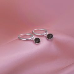 This hoop earrings feature a pair of Fine Cut, Genuine Black Onyx Gemstones. As it is made with 925 sterling silver, it is anti allergic. The hoops are 15mm in Diameter. The total length of the earring including the gemstone charm is 20mm. Also available in 20mm hoops. Choose from sleeper hoops or open hoops stud earrings. Suitable for pierced ears. The earring is packed in a box ready to be gifted. Delivery: We try to ship the order the same working day if ordered before 12pm.  We use Royal Mail First Class signed for, for U.K. , and, Royal Mail signed and tracked for International deliveries. Note: All silver tends to tarnish so it is recommended you clean and wear your silver jewellery regularly to help maintain its shine and prevent tarnishing. If you have any questions, please free to Black Sterling Silver Small Hoop Earrings, Black Minimalist Sterling Silver Hoop Earrings, Black Sterling Silver Hoop Earrings For Everyday, Everyday Black Sterling Silver Hoop Earrings, Nickel-free Black Huggie Jewelry, Black Sterling Silver Huggie Earrings, Black Sterling Silver Round Huggie Earrings, Black Sterling Silver Hoop Earrings, Black Nickel-free Huggie Jewelry