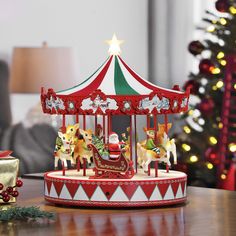 a merry go round carousel with santa riding on it