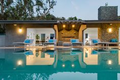 Beverly Hills mansion architectural design opens the indoor living spaces up to the outdoor luxury pool & terrace with sliding glass walls. Modern Style Homes, Built In Grill