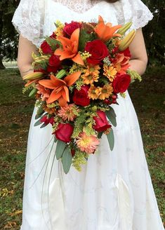 autumn bridal bride traditional cascade wedding orange comes here lilies red roses asiatic berries hypericum september Cinco De Mayo Wedding Ideas, November Wedding Flowers, Fall Wedding Pictures, Cascade Bridal Bouquet, Pretty Wedding Bouquet, Orange Lilies, Orange Lily, Cascading Bridal Bouquets, Autumn Bridal