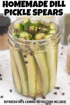 a jar filled with pickles sitting on top of a table