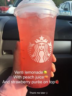 a person holding up a pink drink in their hand with the caption, venti lemonade with peach juice and strawberry puree on top