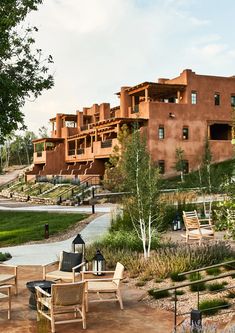 an outdoor patio area with chairs and tables