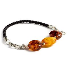 PRICES MAY VARY. PLEASE NOTE! Your bracelet will be nearly, but not quite the same as the picture. COMPLIMENTS EVERY DAY. Wearing this handmade genuine Baltic amber bracelet, your outfit won’t go unnoticed. No wonder, Baltic amber stone is considered superior to other resins, known for its high quality and value. Once it lays on your wrist, you will instantly see and feel the difference in quality, colors, and textures. UNIQUE LUXURY HANDMADE AMBER JEWELRY. Each natural Baltic amber ornament fea Amber Ornament, Amber Bracelet, Classy Jewelry, Amber Stone, Amber Jewelry, Buy Handmade, Baltic Amber, Metal Beads, Gemstone Bracelet