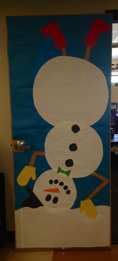 a door decorated to look like a snowman