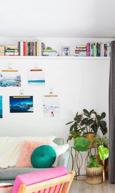 a living room filled with furniture and lots of books